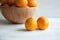 Plain orange mandarins on a grey background