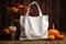 plain white linen bag with copy space against a fall-themed background.