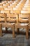 Plain wooden chairs in rows inside Church