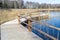 Plains quarry in Olaine, Latvia. Wooden path along the lake. Lake shore, reeds and trail