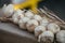 Plait Of Fake Decorative Garlic Laying On Piece Cloth