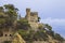 Plajan on the Costa Brava and city beach in Lloret de Mar, Spain. Sand and sea waves.