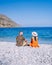 Plaka Lassithi with is traditional blue table and chairs and the beach in Crete Greece