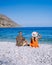 Plaka Lassithi with is traditional blue table and chairs and the beach in Crete Greece