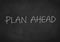Plan ahead text on blackboard background