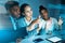 We plan better together. Shot of a diverse group of businesspeople sitting in the office and planning with a cgi screen.