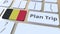 PLAN TRIP text and flag of Belgium on the computer keyboard, travel related 3D animation