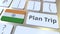 PLAN TRIP text and flag of India on the computer keyboard, travel related 3D animation