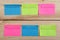 Plan of the week on colored blank stickers on wooden background