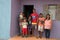 Planaltina, Goias, Brazil-August 23, 2018: A family of seven standing in front of their new home