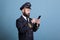 Plane aviator in aviation uniform watching online video