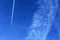Plane with contrails