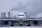 Plane doing taxi on runway, snow in winter