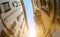 Plane flies high above the roofs of houses. Italy. Soft focus. fish-eye