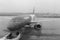 Plane before flight through blurred window with raindrops. Plane black and white. Avaition concept.