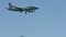 Plane flying in blue sky, aircraft landing at airport, passenger transportation
