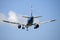 Plane flying in the blue sky amid clouds and sunlight, travel by air