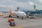 Plane Hong Kong Airlines with jet bridge at airport