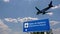 Plane landing in Palma de Mallorca Spain airport with signboard
