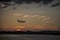 Plane Landing at Reagan National Airport in the Setting Sun