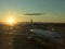 A plane sits on the sunny runways of JFK International