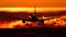Plane spotting at Otopeni airport during sunset with red sky