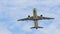 The plane takes off from the airport, picks up speed and height, flies over the camera