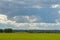 Plane towing a glider after takeoff with a left turn on a background of clouds