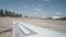 Plane turns around, turns on runway, asphalt strip old airfield. Wing view