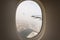 The plane-the view from the window of the porthole on the city Arab Emirates Dubai.