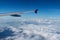 Plane wing on the blue sky and clouds,can be used for air transport to travel and open season to travel background.