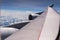 Plane wing and Clouds in airplane window