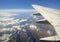 Plane wing over mountains