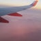 Plane wing pink atmosphere sunrise