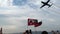 Planes flying on sky on the liberty day of Izmir for a demonstration. People waving Turkish fla