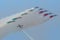Planes jet with Soloist at the italian tricolor arrows air show performs a cross acrobatic figure
