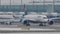 Planes moving in Munich Airport, winter time with snow