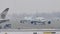 Planes moving in Munich Airport, winter time with snow