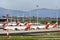 Planes on the runway of Madrid Barajas airport with mountains in the background