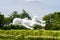 Planet bronze and steel sculpture showing white oversized baby in Gardens by the Bay in Singapore