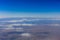Planet earth. Blue sky, white clouds, land. View from above.