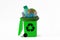 Planet Earth into recycle can with plastic trash - Concept of recycling and ecology