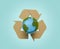 Planet earth with wood recycling symbol