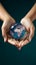 Planet safeguard Female hands hold a globe, emphasizing environmental protection