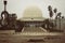 Planetarium of Castellon surrounded by palm trees under a cloudy sky in Spain