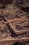 Plank frames defining sites for new graves at a Russian cemetery in St. Petersburg, Russia