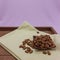 On a plank tray, almond kernels in a square wooden plate