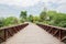 Planked footbridge in cloudy summer afternoon