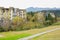 Planked pavement on lawn before houses in mountain