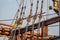 Planks, ropes, pulleys, tackle, and rigging of a replica of a 1400\'s era sailing ship